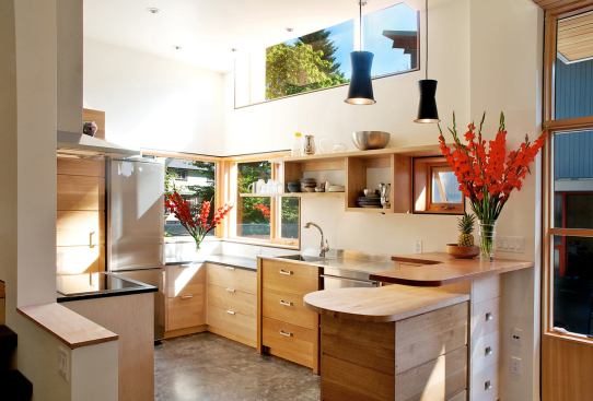 In the kitchen, architect James Tuer placed windows up high to maximize natural daylight.