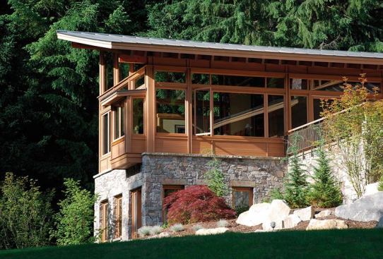 The bedroom wing departs dramatically from the great room wing, with a linear floor plan topped by a roof with a corner-to-corner ridge beam.