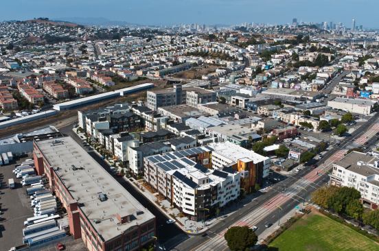 Armstrong Place Senior and Family Housing fills a former industrial city block with affordable family townhouses and adjacent senior apartments.