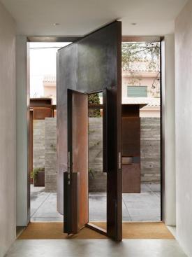 With the larger door open, the entry courtyard becomes available for large family gatherings.