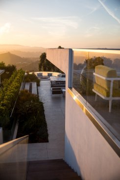 Beverly Hills modern home two story roof terrace with fire pits and views.