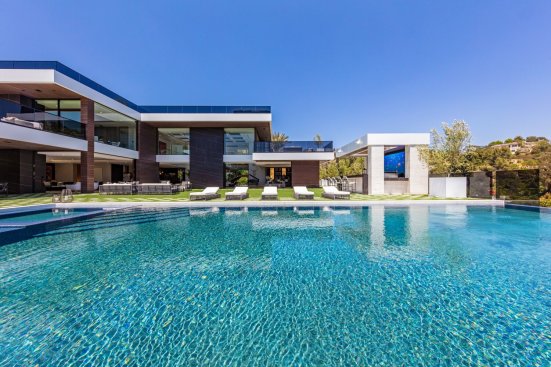 Luxury resort style living at poolside Los Angeles modern home.