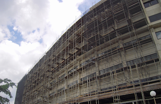 Scaffolding supported a phased, exterior window renovation to minimize occupant disruption