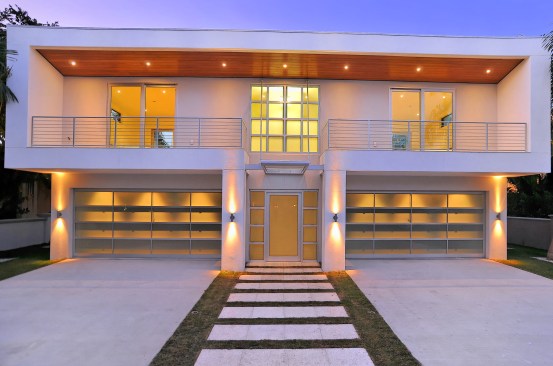 Street elevation of guest house and garage. The middle door is the entrance porthole to the interior courtyard.