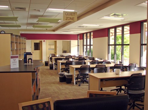 View of fixed/open study/reading areas with natural light and views