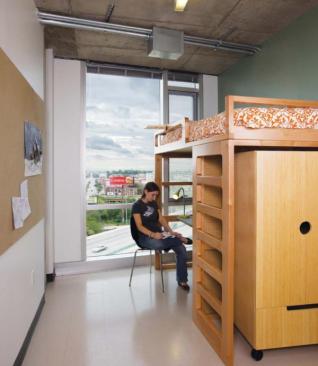 Most of the apartments are three- and four-bedroom units, meaning that the individual rooms are extremely compact. Custom furniture by Coriander Designs combines all of the functional necessities - bed, desk, and armoire - into one unit, made from sustainably grown maple, that can be reconfigured to meet individual student needs. Homosote panels provide pinup space so that the artists can display their work, and operable windows ensure natural airflow to dispel any fumes from art supplies.