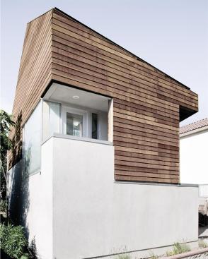 Cutouts in the building volume create sheltered outdoor spaces.