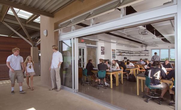 The classrooms in the science center feature sliding glass walls that open the rooms to the outdoors. The school's casual teaching style means that the views are not seen as a distraction to learning.