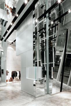 Kinetic mirror installation over cash wrap