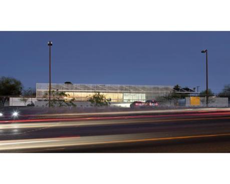 Seen at night, the building is a welcome change to the neighborhood.