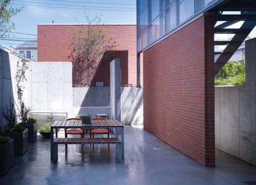 A view of the exterior stair from a neighboring yard.