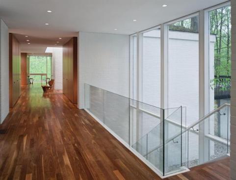 The opposite view from the glass entryway, looking toward the public area from the bedroom pavilion. 