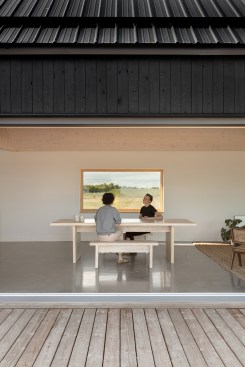 Opening the large sliding door creates a fluid indoor/outdoor space for dining.