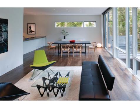 Walnut flooring anchors the white walls and millwork.