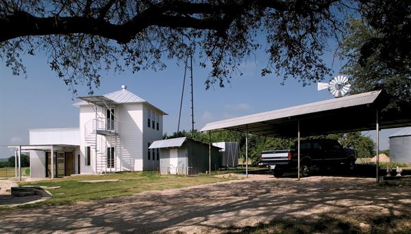 Situating the guesthouse/party barn close to the existing house defines a cozy outdoor space where the owners and their guests can hang out.