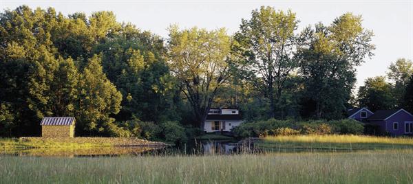 In back, another wall extends from a new stone well house through the pond to a swimming pool and bath house, marking the boundary between cultivated and natural landscapes.