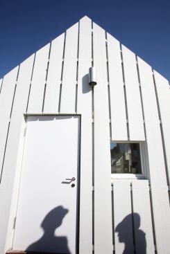 The University of Illinois used refurbished wood from an old barn for the Gable House's siding.