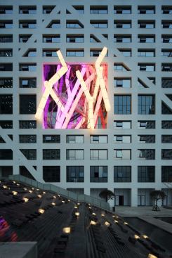 An installation designed by Lebbeus Woods is integrated into the tower facade.