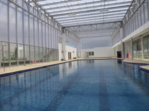 The building is clad in translucent polycarbonate
