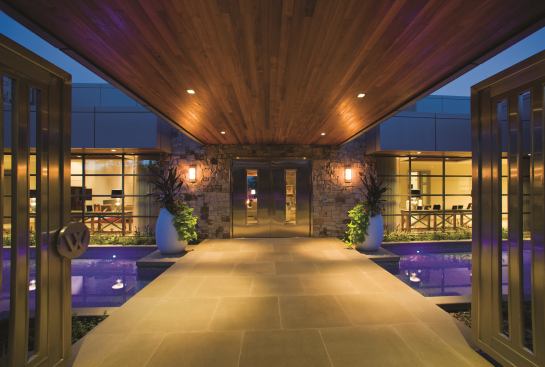 In the Idaho pines, modern houses like this one are a rarity. A reflecting pool in the entry courtyard adds a peaceful feeling. Project: The W Residence, Coeur d’Alene, Idaho; Builder: Doric, Inc., Spokane, Wash.; Architect: Eric Hedlund Design, Coeur d’Alene; Landscape Architect: Riverview & Verdis, Coeur d’Alene