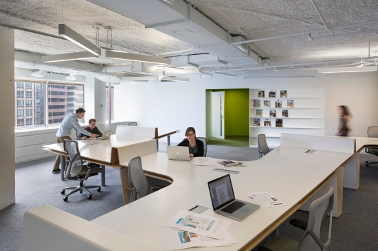 Integrated shelving and bright green conference areas accent the space around the Radar Desk.