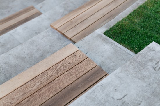 Timber platforms have been fixed on the top of the concrete steps to offer warm sitting areas to the users of the square. 