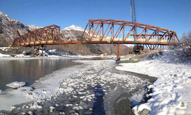 The+bridge+was+constructed+from+both+sides+of+the+Placer+River%2c+with+crews+working+in+three-+to+four-month+windows+over+the+course+of+three+summers.