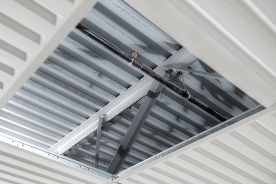 The thermoformed panels could be installed as a drop-out ceiling beneath existing sprinklers.