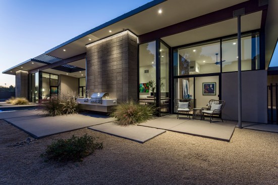 Back guest patio is accessible to the nearby front guest parking as well as to the back pool patio. The 
large glass clerestory provides ample views to the mountains beyond and light while limiting direct sun light. 