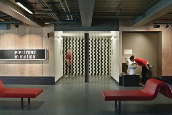 While+much+of+the+exhibit+space+is+lit+by+clerestory+windows+that+run+the+length+of+the+shed%2c+some+exhibits+required+a+more+controlled+level+of+light%2c+and+were+strategically+located+in+darker+areas+of+the+exhibit+floor.