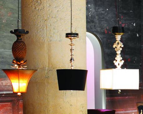 Individualized table lamps meet the character of the space and offset the eclectic furniture groups. To meet wattage restrictions for Title 24, these table lamps do not exceed 41W. Three 7W candelabra lamps provide an understated glow and 20W MR16 spotlights provide punch on the white tabletops.