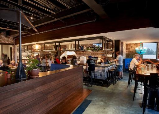 Housed in a corporate office building, the team brought in stone veneer walls to match the rest of the building.