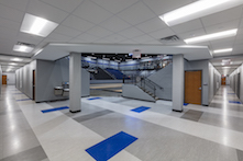 Rockfon Artic® stone wool panels were installed within Chicago Metallic® 1200 15/16-inch suspension system on the lower level's offices, lounge, hallways and gym locker rooms.