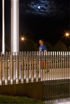 The masts provide visually comfortable vertical illumination, lighting pedestrians’ faces to provide a greater sense of security. All of the lighting elements are controlled via time clock.