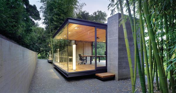 The board formed concrete towers provide a textured contrast to the smooth glass and steel.