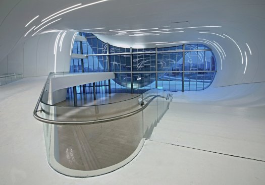 The+center%27s+three+main+programs+join+together+in+a+main+hall+with+multiple+levels+and+pathways.+