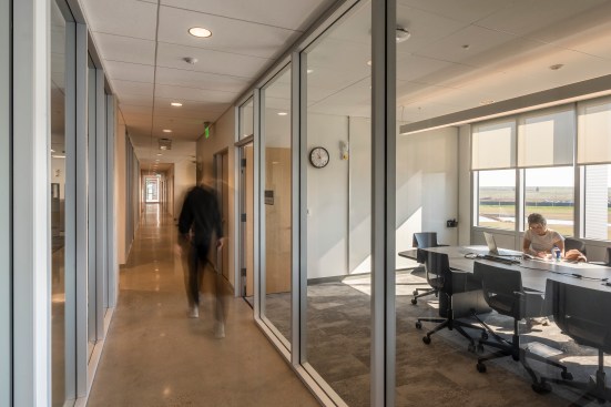 Daylight and views reach into all spaces, including the computational labs, achieved through internal glazing and thoughtful space planning.