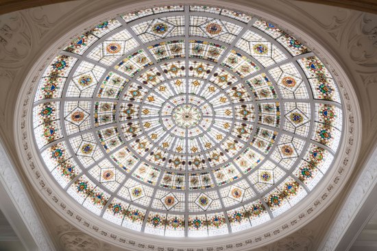The rotunda is topped by a spectacular Tiffany glass dome measuring 40 feet in diameter.