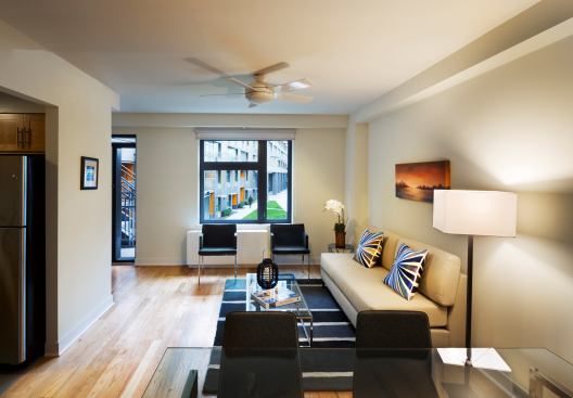 A typical townhouse unit. Ceiling fans and dual-façade operable windows encourage natural cooling through cross-ventilation.