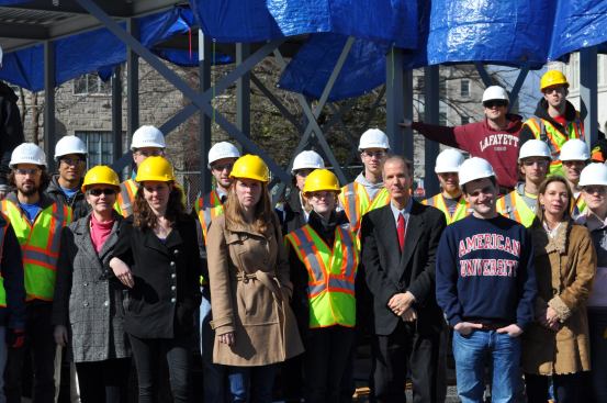 Catholic University of America's Dean of the school of architecture, Randy Ott (center) with students participating in the three-school venture, Team Capitol DC's entry into the 2013 Solar Decathlon.