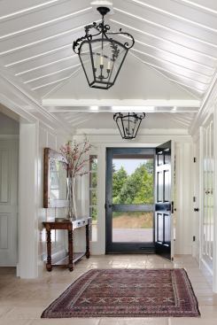The entry hall is a generous, welcoming space with vaulted ceilings.