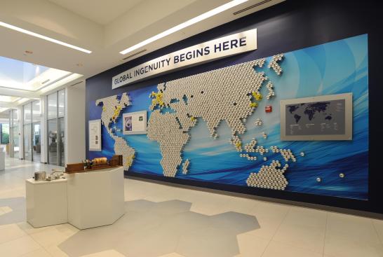 A global map made of recycled aluminum cans, which are produced with Novelis rolled aluminum