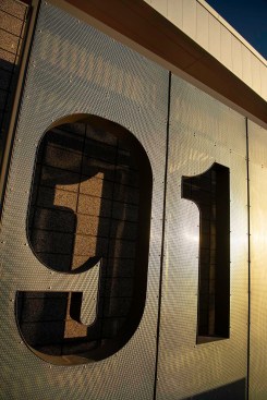 Signage, and the “house number”, had to be well defined and easy for the community to find. A perforated, carefully detailed, metal screen serves dual purpose. It highlights the project entry identifying the house number as a super-sized “91”. Additionally, the metal screen protects the glazed entry from the harsh sun exposures. 