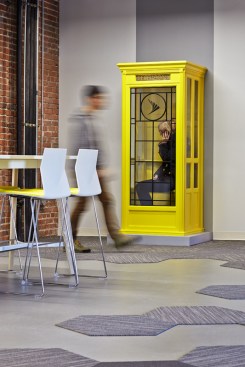 As+a+nod+to+the+history+of+telecommunications%2c+an+original%2c+early+20th+Century+telephone+booth+was+painted+Sprint+yellow+and+modified+with+data+ports+and+USB+connections%2c+serving+as+a+both+fun+pop-up+art+and+functional+space.