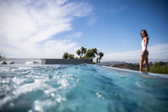 Luxury Beverly Hills home backyard swimming pool with views.