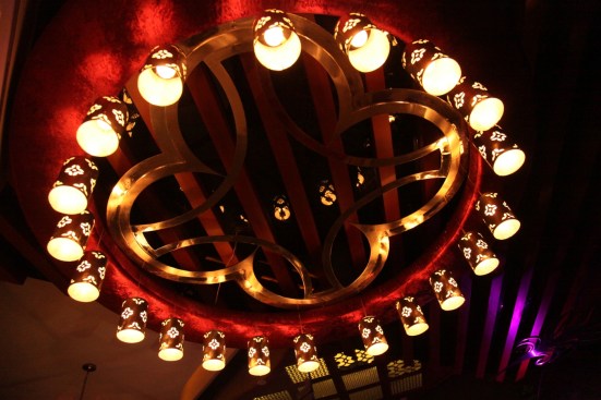 The Set of lamps around the ring bounding the quatrefoil motif in the ceiling of the waiting area.