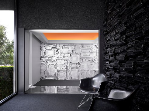The presenter’s view of the training room inspires the guests.  Suspended recycled toner cartridges create a celestial ceiling. The reflection to the left has been affectionately described as the “smudge.”   