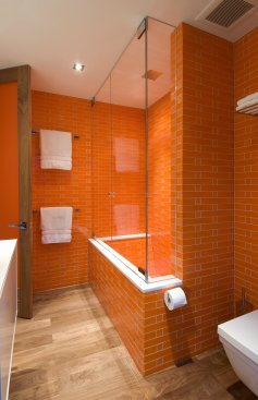 Hopen Place Hollywood Hills modern home guest bathroom with orange tile decor