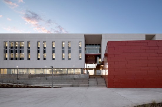  A shaded walkway or paseo, creates a procession through the building from the hardscaped quad to the natural landscape of an adjacent meadow, while addressing a significant grade change.