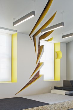 In+the+large+pitch+area%2c+the+sprint+logo+was+worked+into+the+drywall+and+ceiling+soffit%2c+painted+bright%2c+Sprint+yellow+and+exposing+original+brickwork+from+the+century-old+building.